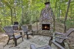 Stone outdoor wood-burning fireplace